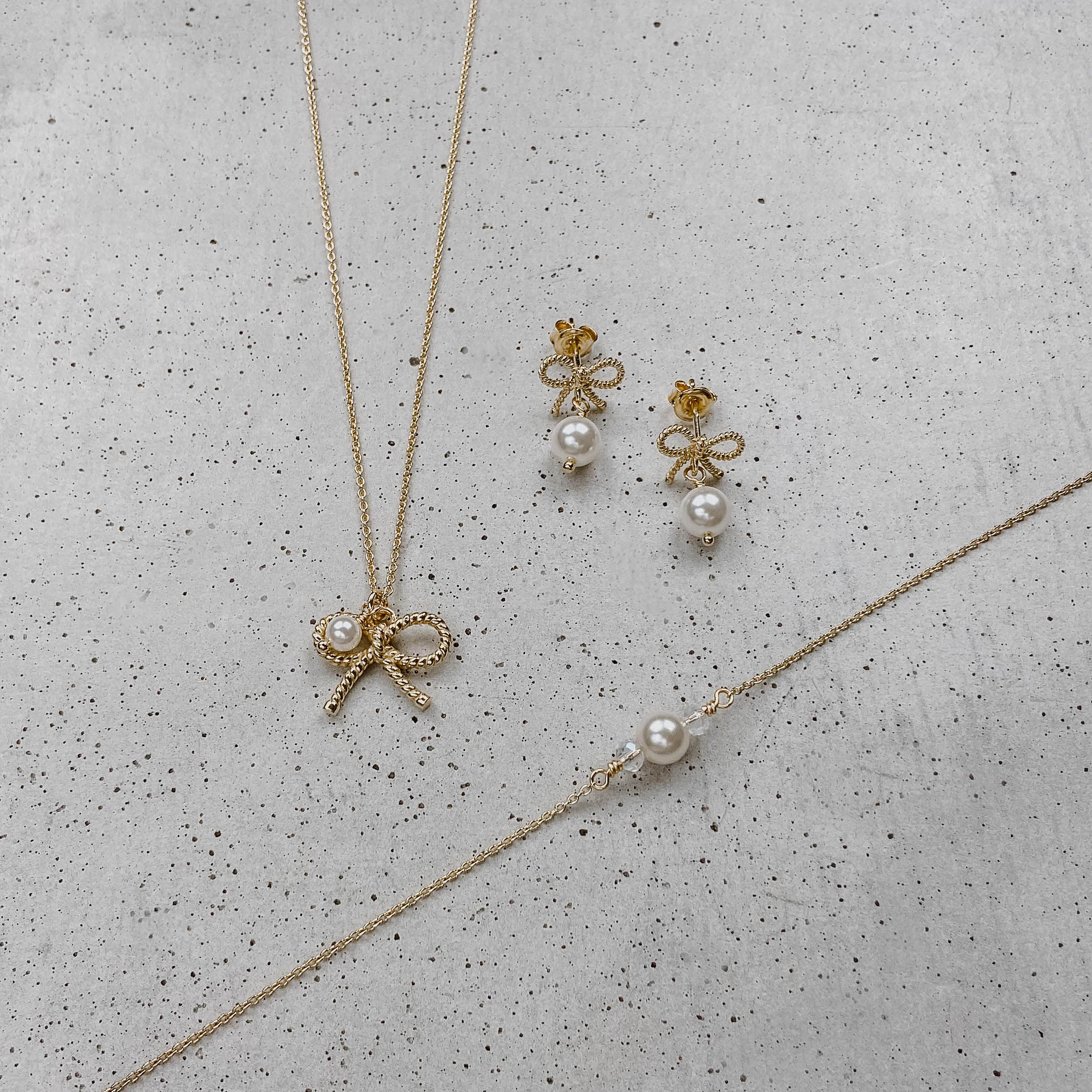Perlenbräute Ohrringe Pinella Brautohrringe Gold Schleife Perle